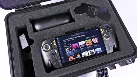 Open Pelican case with custom foam holding the powered-on ROG Ally X20 handheld, 68W charger, and AR glasses case.