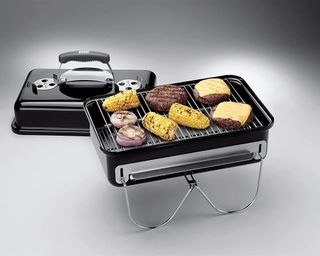 Weber Go Anywhere BBQ cooking with chicken, corn, burgers and red onion