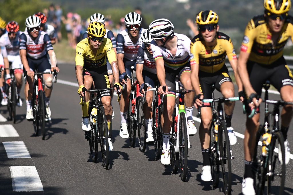 Team Jumbo rider Slovenias Primoz Roglic wearing the overall leaders yellow jersey 3rdL talks with Team Trek rider Denmarks Mads Pedersen 3rdR and Team Trek rider Australias Richie Porte 4thR during the 16th stage of the 107th edition of the Tour de France cycling race 164 km between La Tour du Pin and VillarddeLans on September 15 2020 Photo by AnneChristine POUJOULAT AFP Photo by ANNECHRISTINE POUJOULATAFP via Getty Images