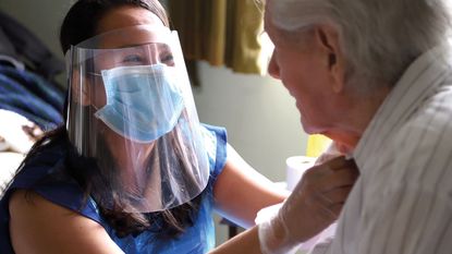 Careworker and client © Karwai Tang/Getty Images