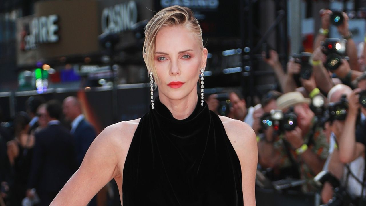 Charlize Theron's Dress With A High Slit Is Stunning, But It's Her Over-The-Top Gloves I Can't Stop Looking At