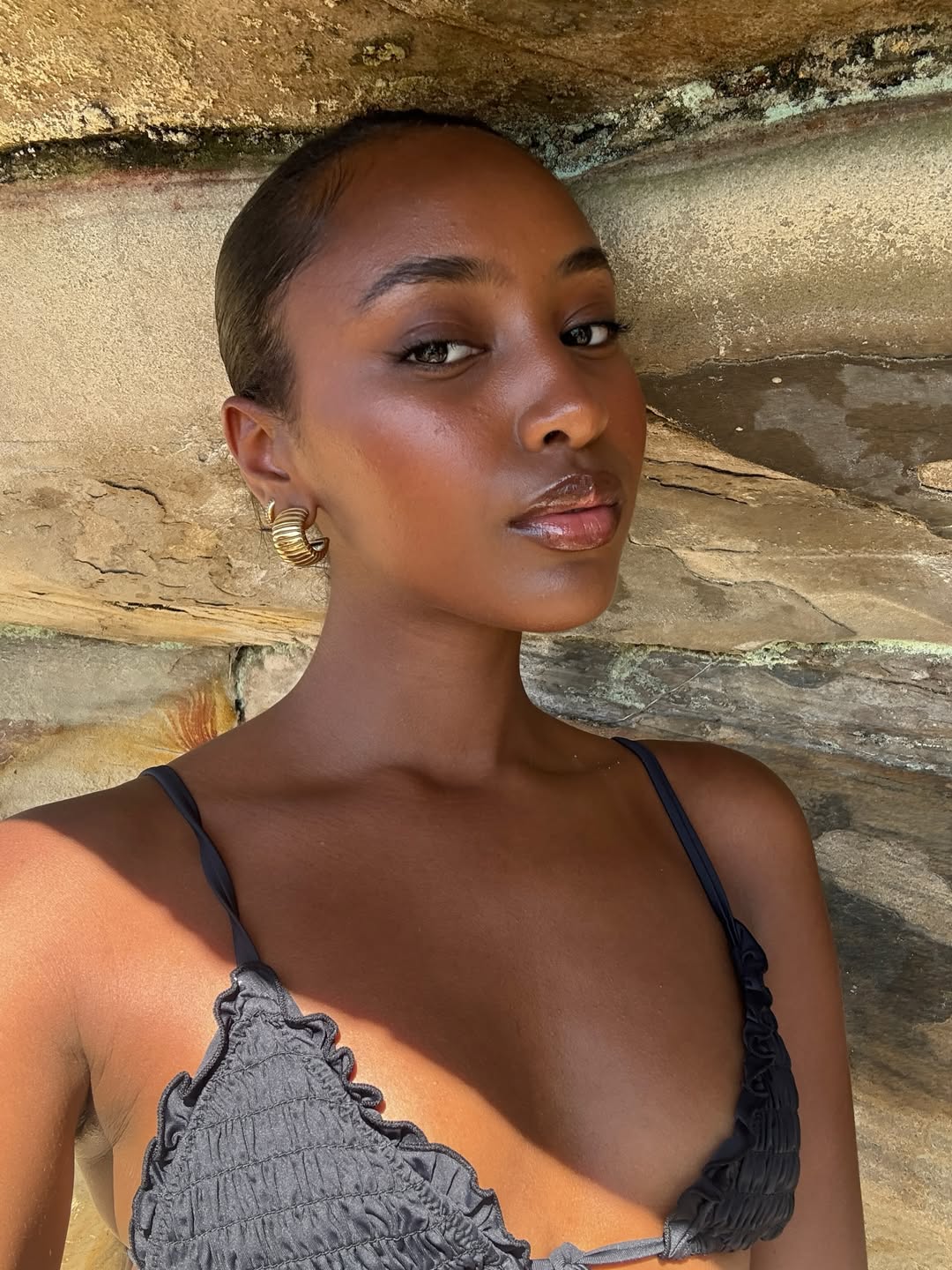 Rayan Xasan with sun-kissed skin and bronzed makeup