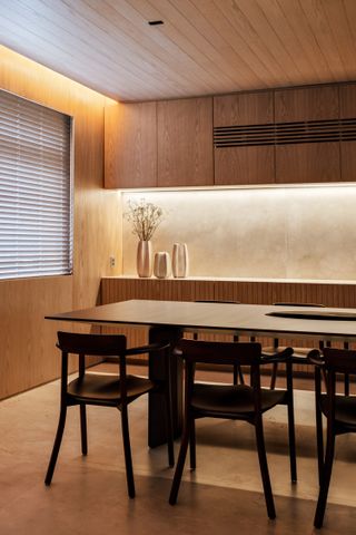 A kitchen with recessed lights