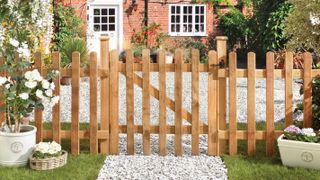 wooden picket fence at the front of a house