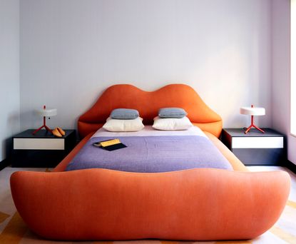 a bedroom with a bed made of lips