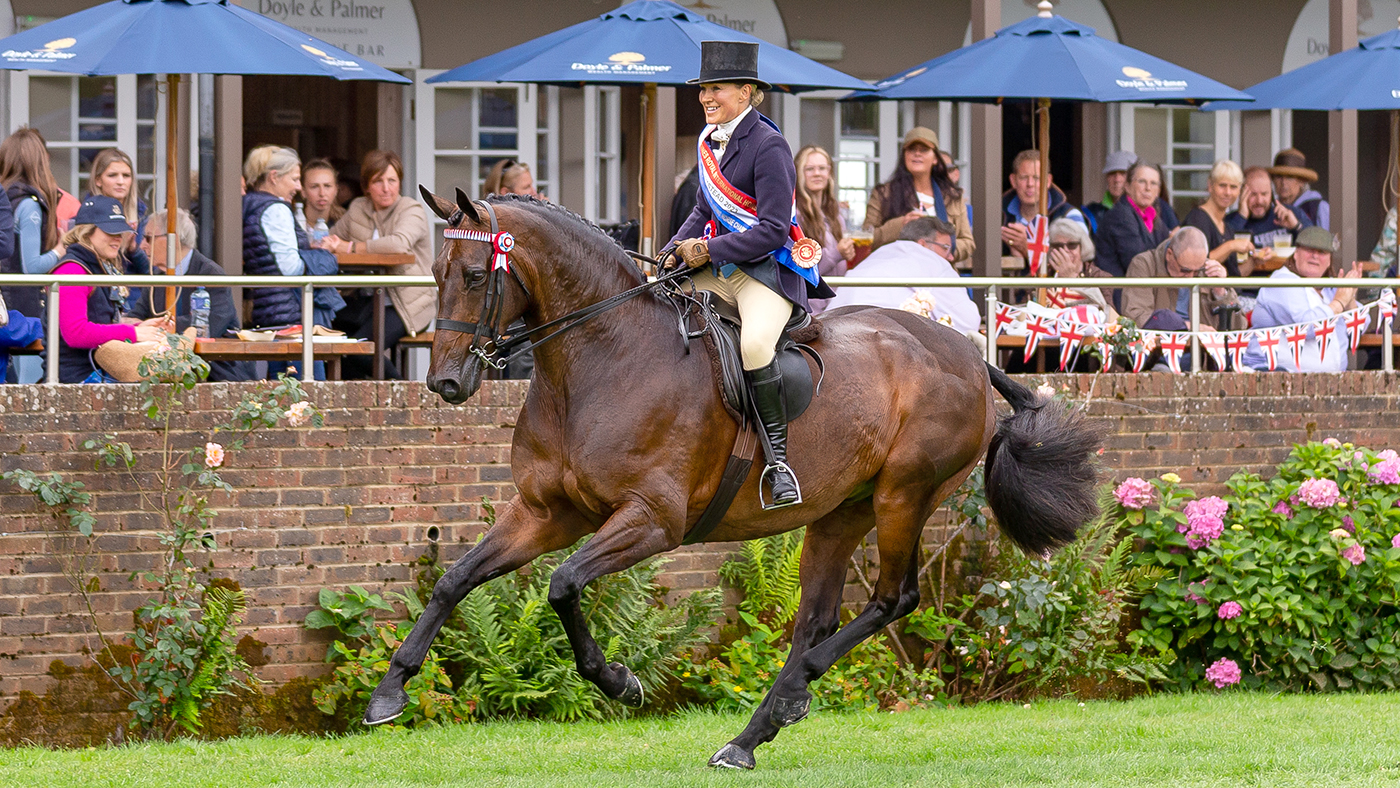 Rising Star judge Danielle Heath and riding horse Times Square II demonstrate how to give a good gallop at the Royal International Horse Show