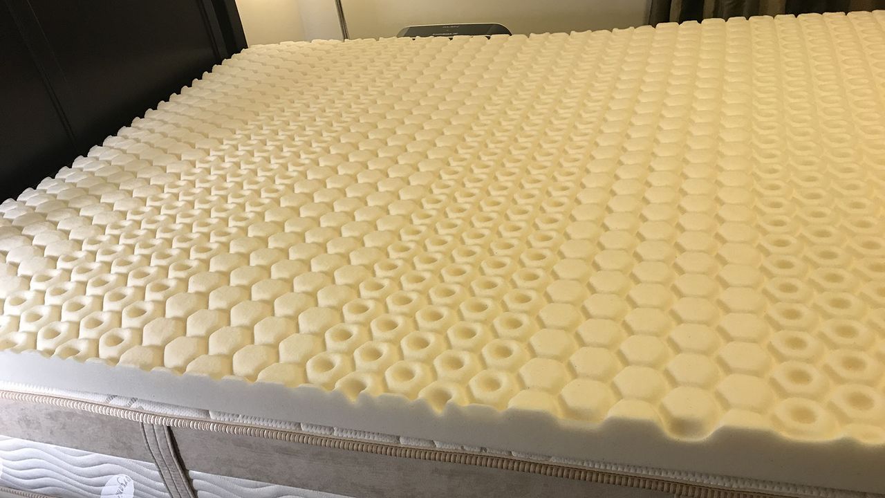 A close-up of the Molecule CopperWell Mattress Topper's open-cell foam surface.