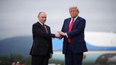 Russian President Vladimir Putin and President Donald Trump shake hands in Alaska
