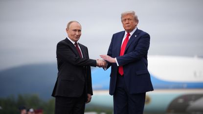 Russian President Vladimir Putin and President Donald Trump shake hands in Alaska