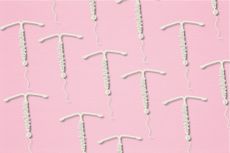 multiple IUDs in rows on a pink background