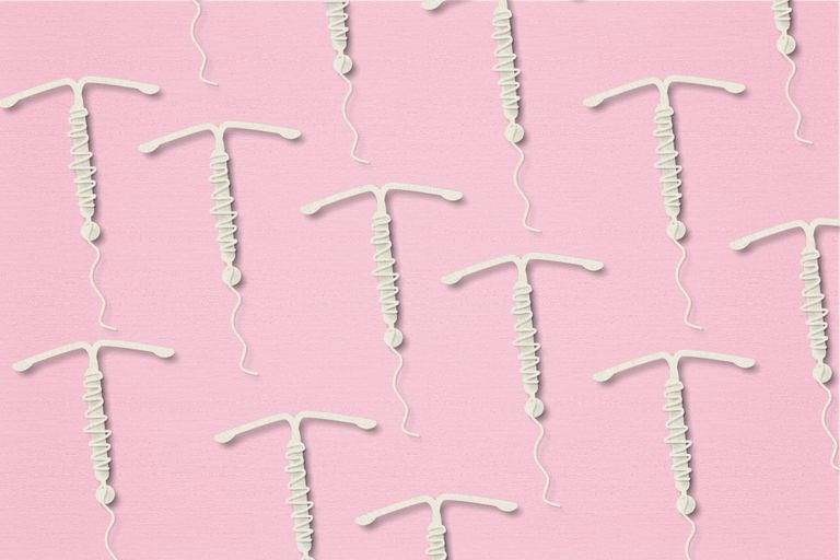 multiple IUDs in rows on a pink background