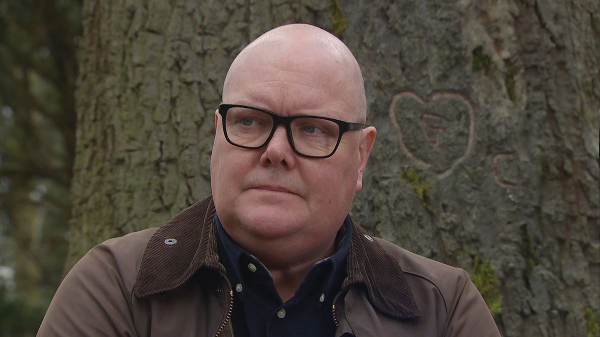 Paddy Dingle looking sad by a tree. 