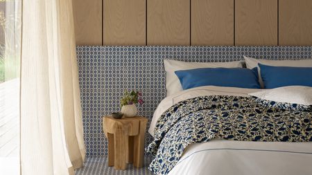 A contemporary bedroom with tiled and wood-paneled walls