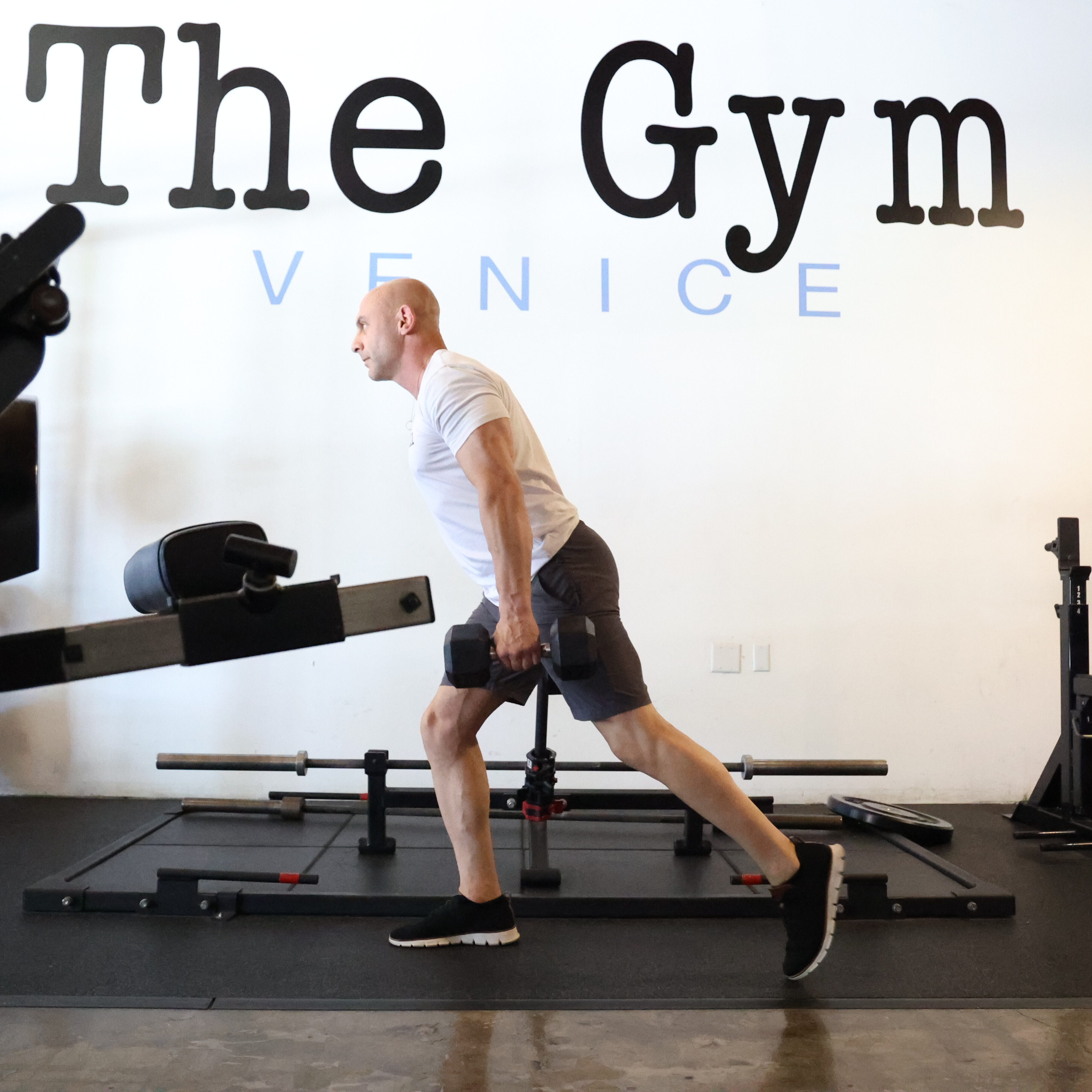 Man exercising in gym with kettlebell