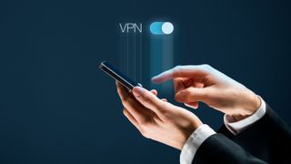 Hands in shirt cuffs holding a mobile device, with the word 'VPN' above it