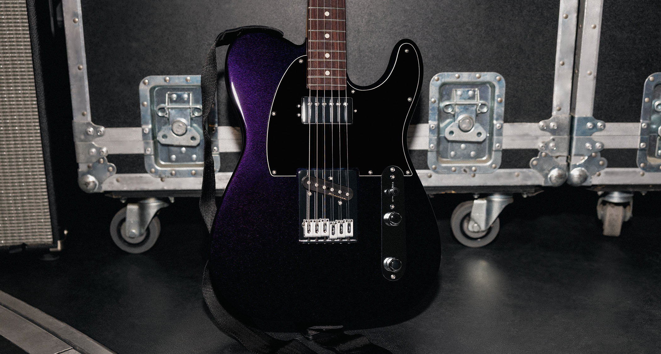 Fender Player II Modified Telecaster SH: the factory-modded, humbucker-equipped Telecaster is finished in Dusk, a dark metallic purple, and is photographed backstage.