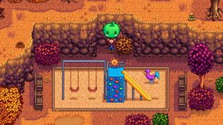 Stardew Valley player holding up a Jumino plush in a playground