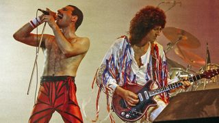 Photo of Brian MAY and Freddie MERCURY and QUEEN; Freddie Mercury and Brian May performing live on stage in 1985