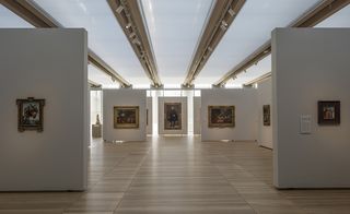 Art gallery with white walls and paintings