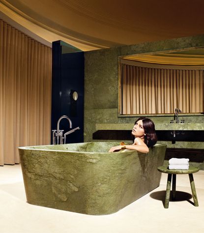 1.2 tonne bath green marble bathroom in the The Dome Suite at Hotel Café Royal London, UK
