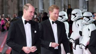 Prince Harry and Prince William with storm troopers at Star Wars premiere