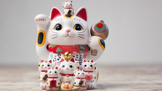 Waving cat figurine