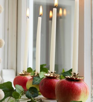 window sill with apple candle holders
