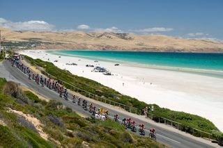 The peloton passes by Aldinga beach during the 2023 Tour Down Under men's race