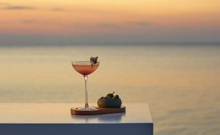 cocktail on table at sunset