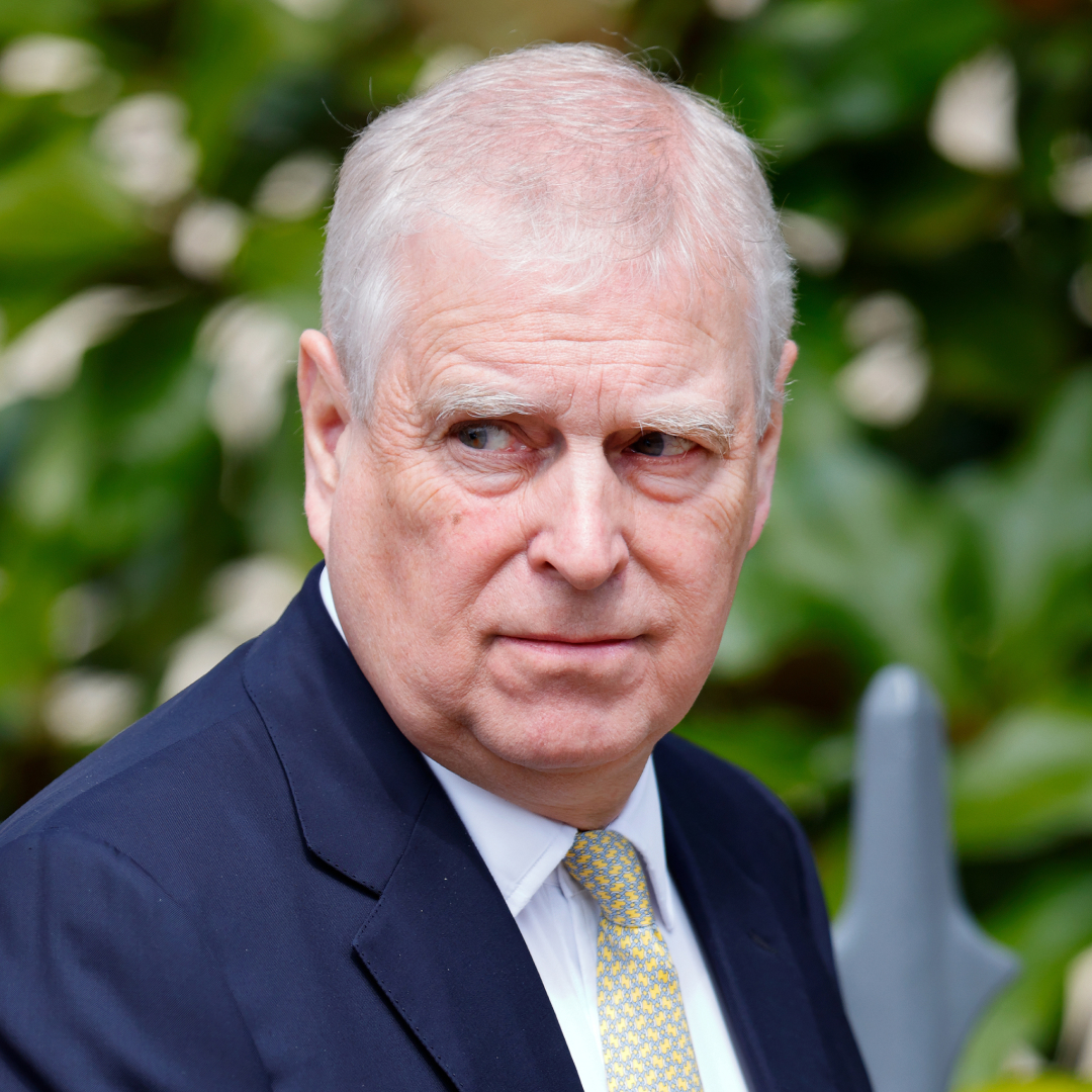 Andrew Mountbatten-Windsor wearing a suit and tie and scowling