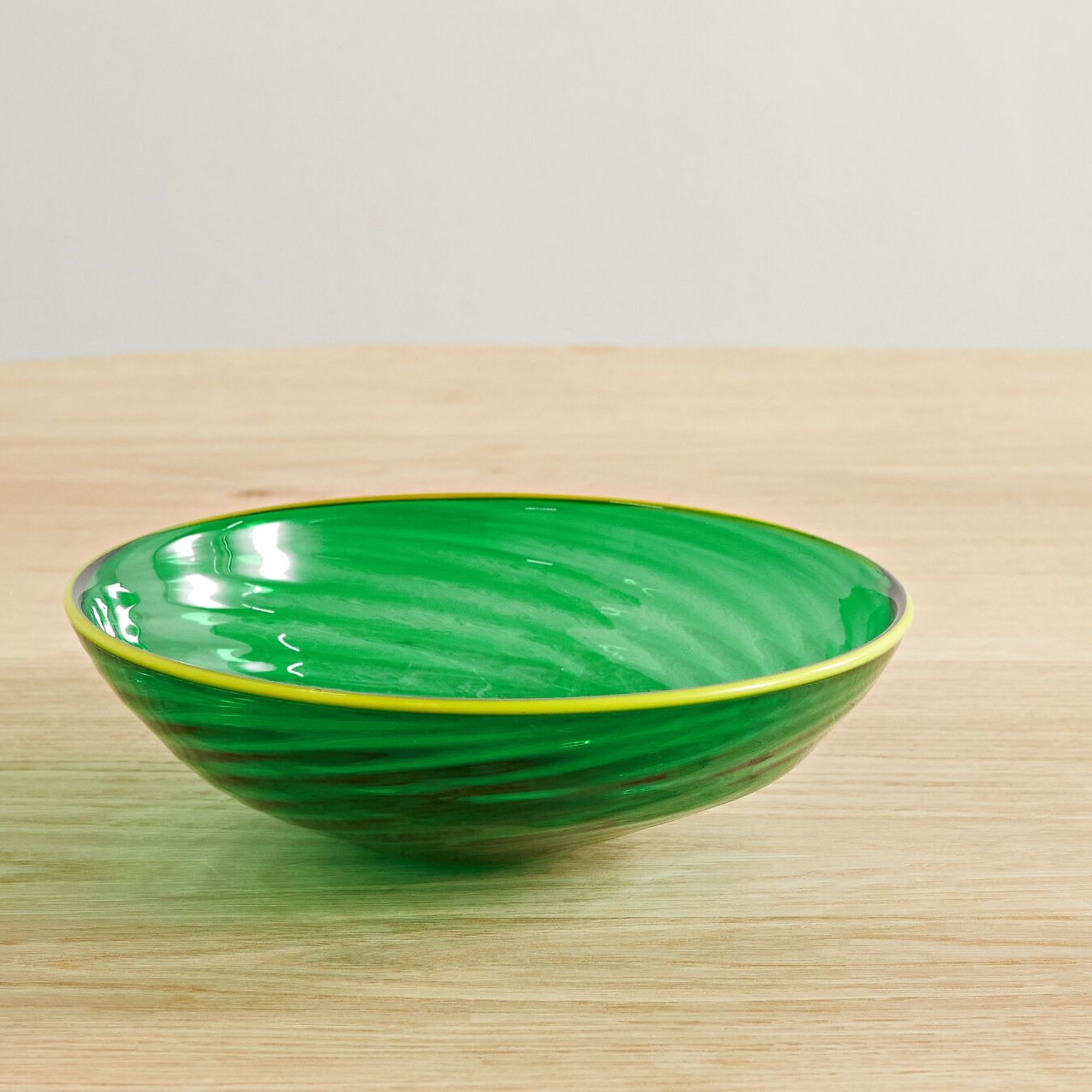 Bright green Murano glass bowl with yellow rim