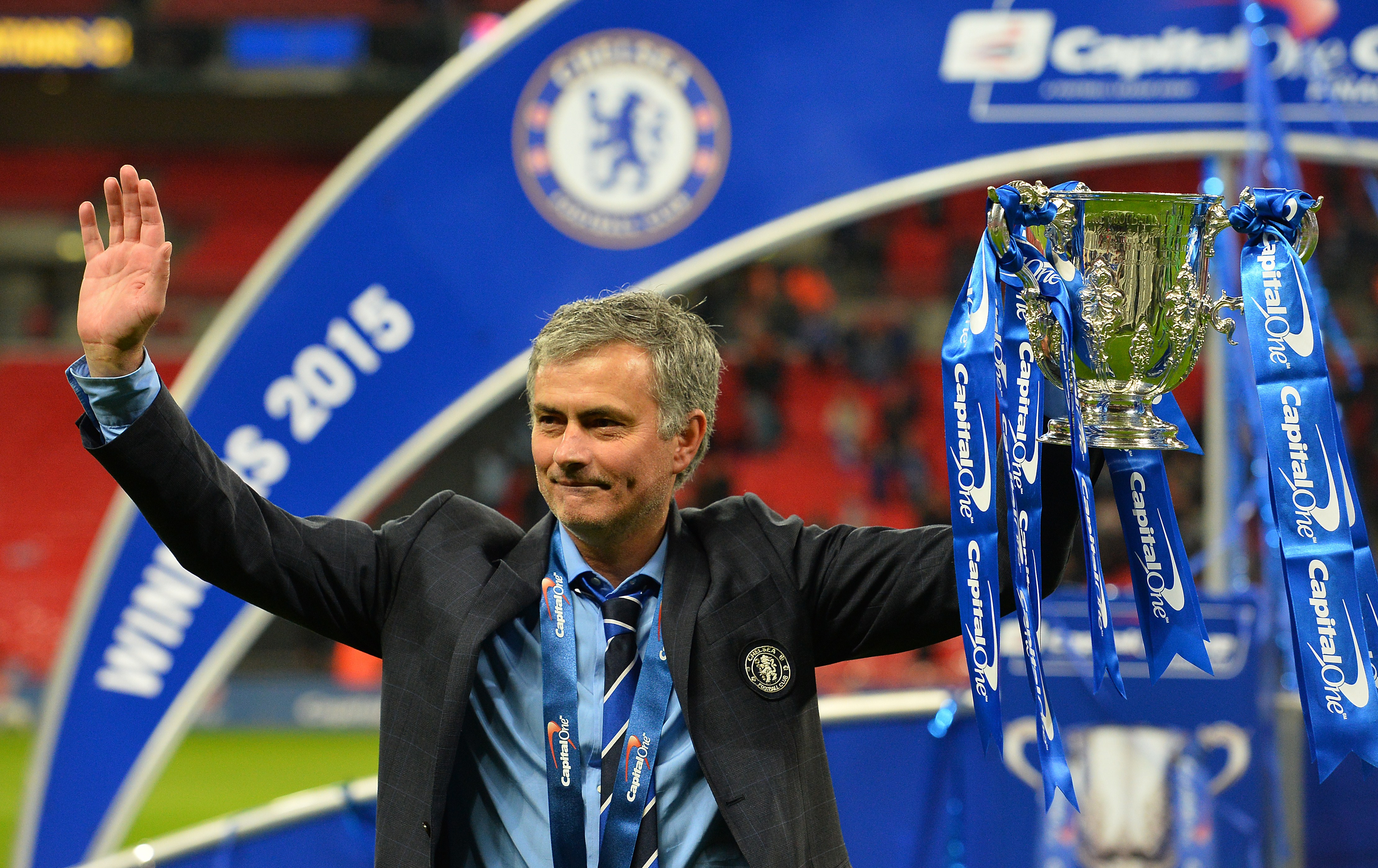 Jose Mourinho celebrates with the League Cup trophy after Chelsea's win over Tottenham in the 2015 final.