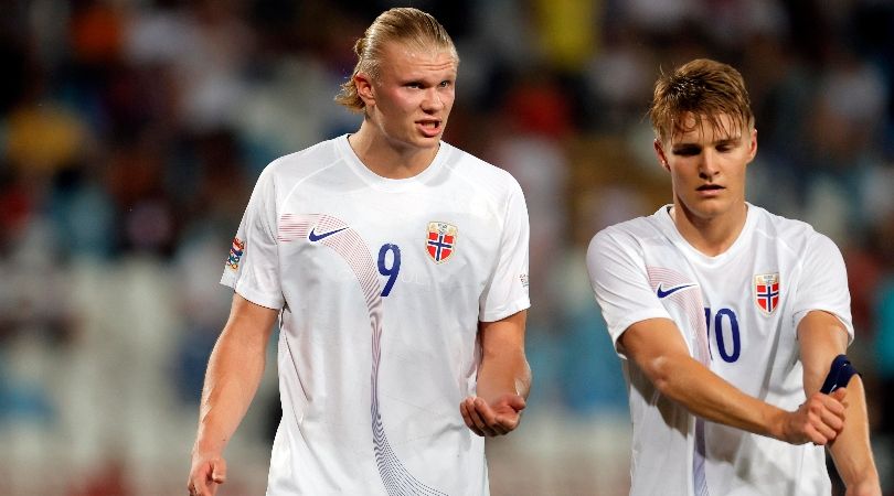 Erling Haaland and Martin Odegaard in conversation during Norway&#039;s UEFA Nations League game against Serbia in June 2022.