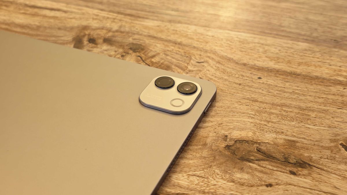 A photograph of the Honor MagicPad 4 in use on a wooden table.