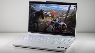 Lenovo Legion 7i Gen 9 open on a white table at an angle with Far Cry 6 on screen.