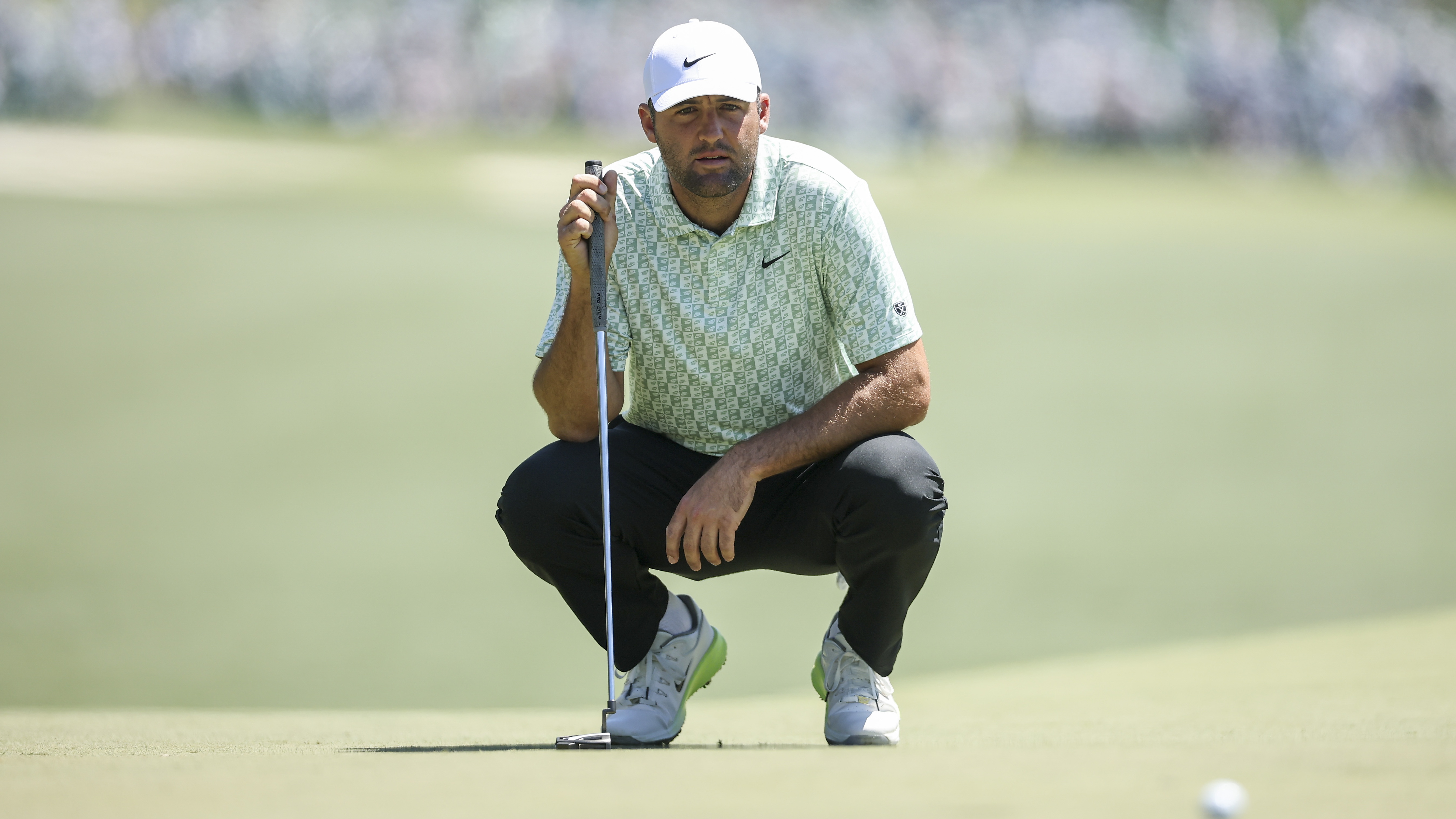 Scottie Scheffler of the United States looks over a putt on the first hole during the first round of the 2026 Masters Tournament at Augusta National Golf Club on April 09, 2026 in Augusta, Georgia.