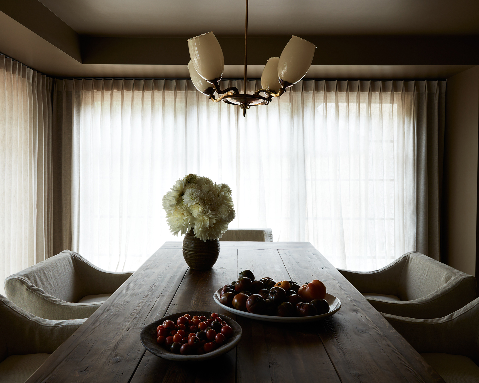 dining room with wooden table and brown walls