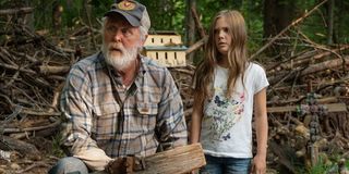 John Lithgow as Judd Crandle, and Jeté Laurence as Ellie Creed in Pet Sematary