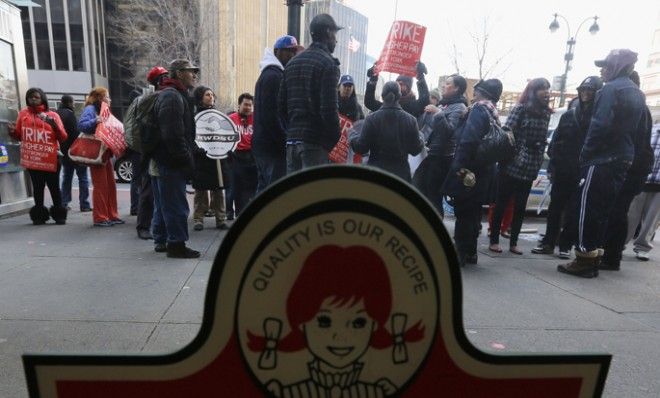 Fast food workers protest for better wages outside a Wendy&amp;#039;s restaurant in New York, April 4.