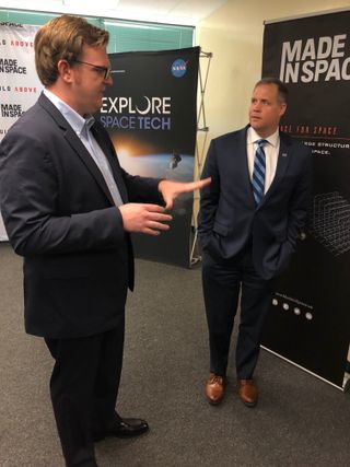 Made In Space president and CEO Andrew Rush (left) talks to NASA Administrator Jim Bridenstine during a media event at NASA's Ames Research Center on Aug. 26, 2019.