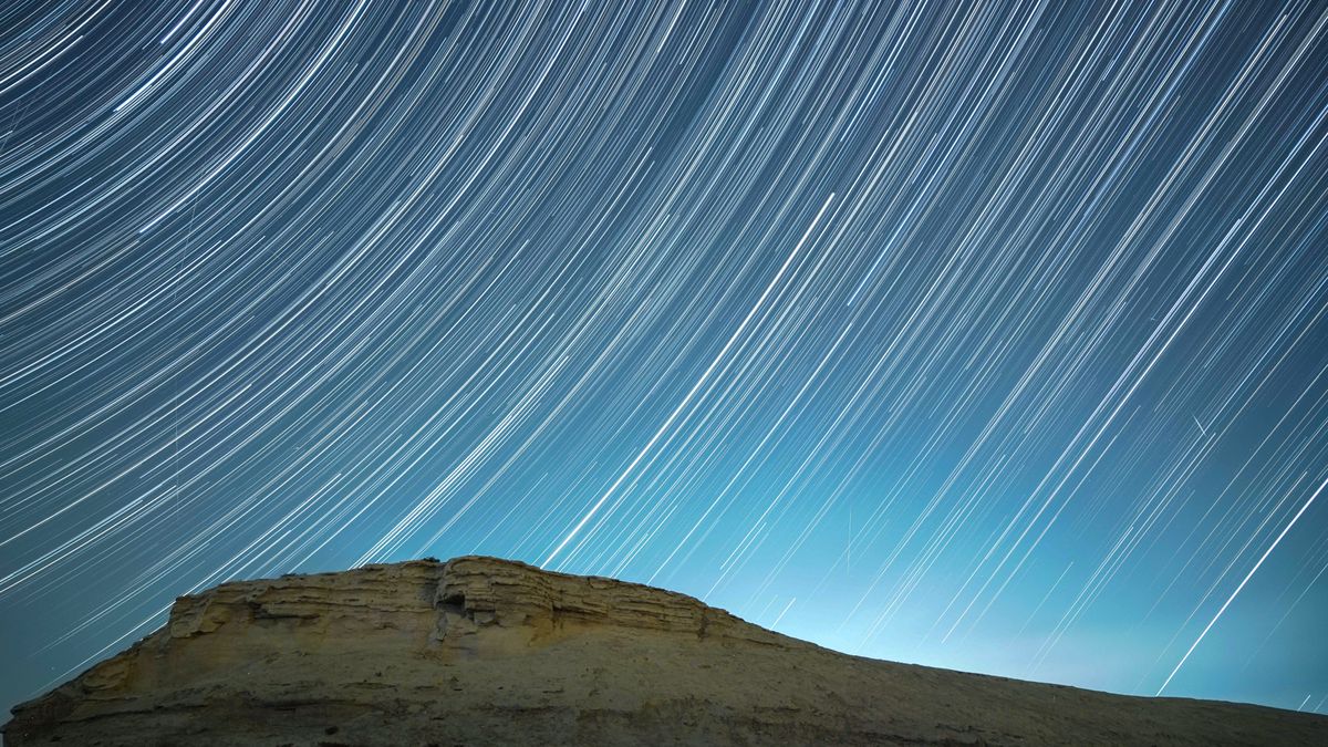 A meteor streaks across the night sky in Bazhou, Xinjiang Province, China, in the early morning of December 14, 2021. 