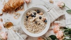 Healthy breakfast with porridge and croissant