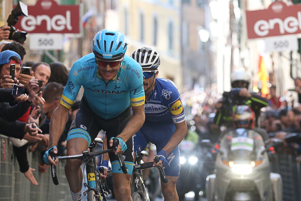 Jakob Fuglsang leads Julian Alaphilippe into Piazza del Campo in Siena