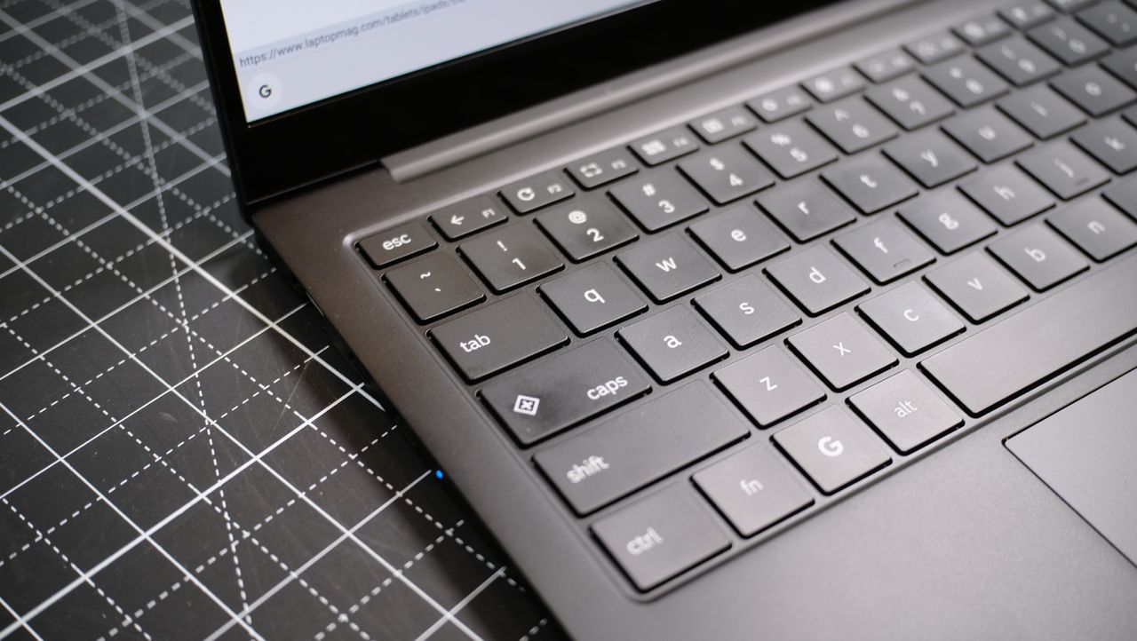 Samsung Galaxy Chromebook Plus keyboard with a black cutting mat behind it
