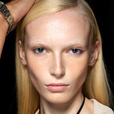 alex consani backstage with bronzed cheeks