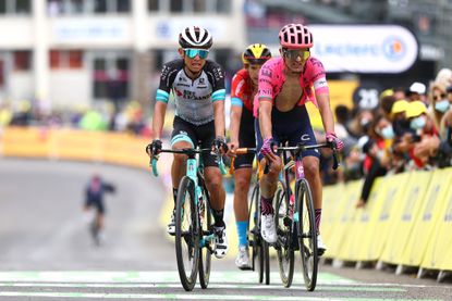 Esteban Chaves finishing stage 18 of the 2021 Tour de France alongside Ruben Guerreiro and Dylan Teuns