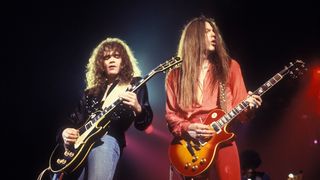 L-R: Brian Robertson, Scott Gorham performing live onstage