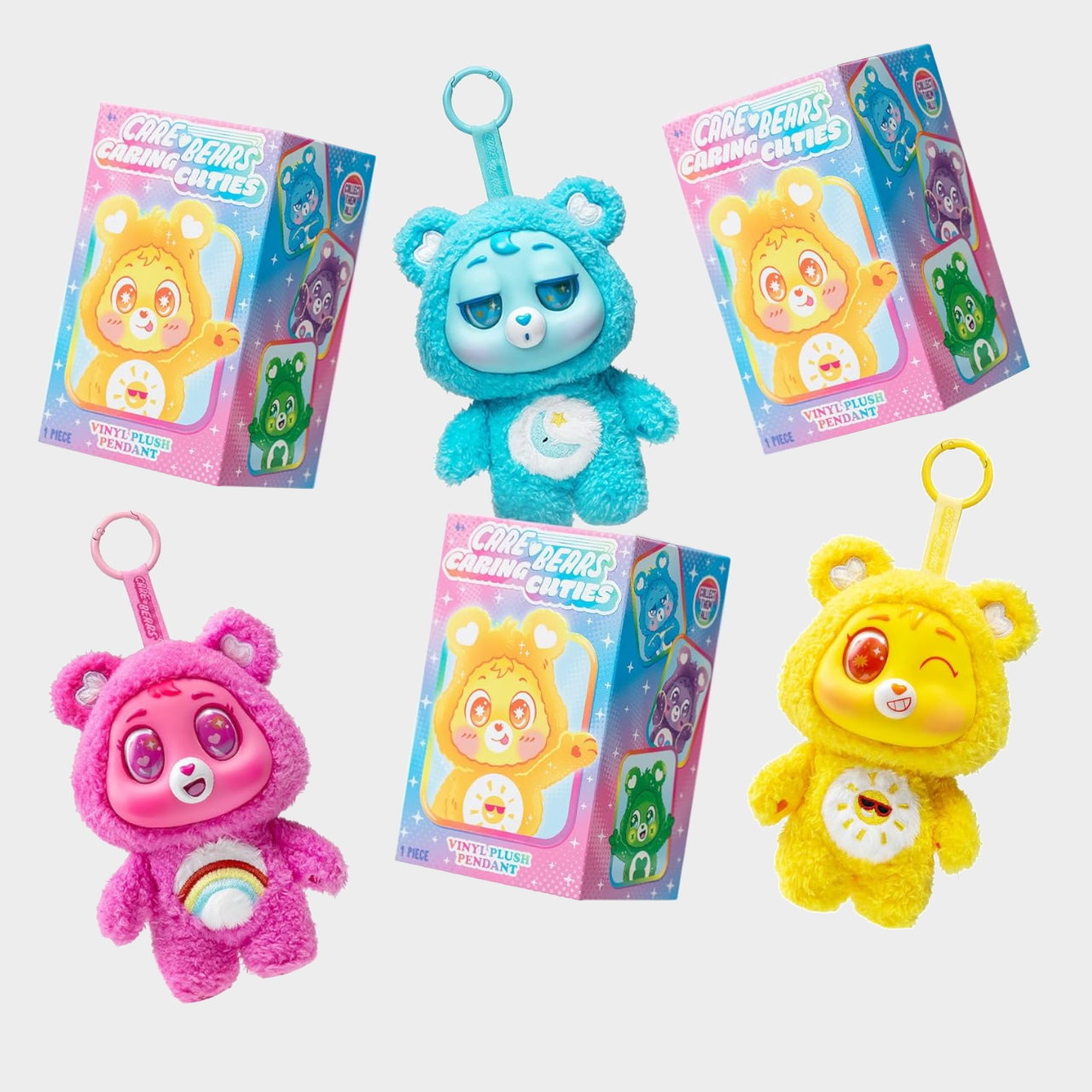 Caring Cuties plush toys and boxes on a plain background