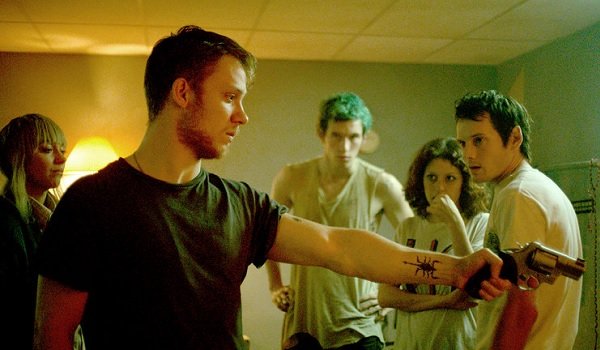 Green Room Mark Webber aims a gun at off screen danger