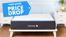 Nectar memory foam mattress shown on a white wooden bed frame with a blue price drop badge overlaid
